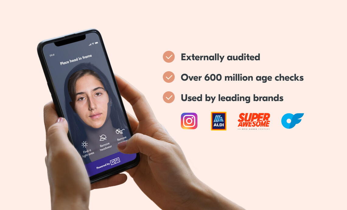 An image of a person's smartphone. The person is using Yoti's facial age estimation technology. Next to this image, the text reads: "externally audited, over 600 million age checks, used by leading brands". Underneath this list are the logos of Instagram, Aldi, SuperAwesome and Only Fans.