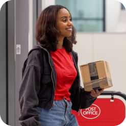 Woman collecting parcel from the Post Office