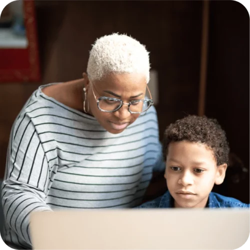 Mother and son accessing content online together