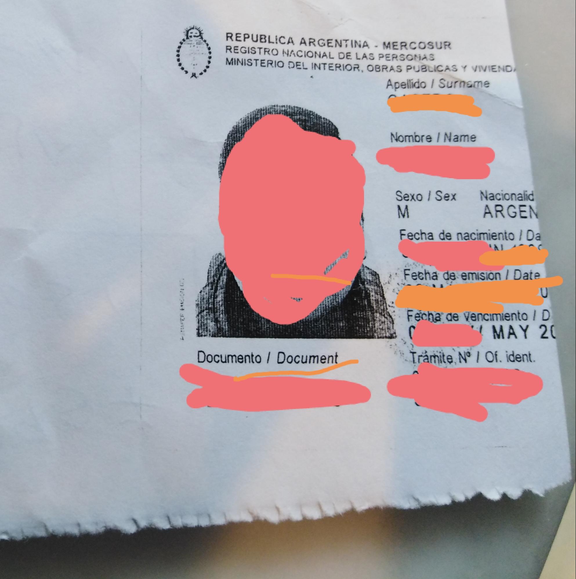 an image of an Argentinian identity card with the key identifying details redacted