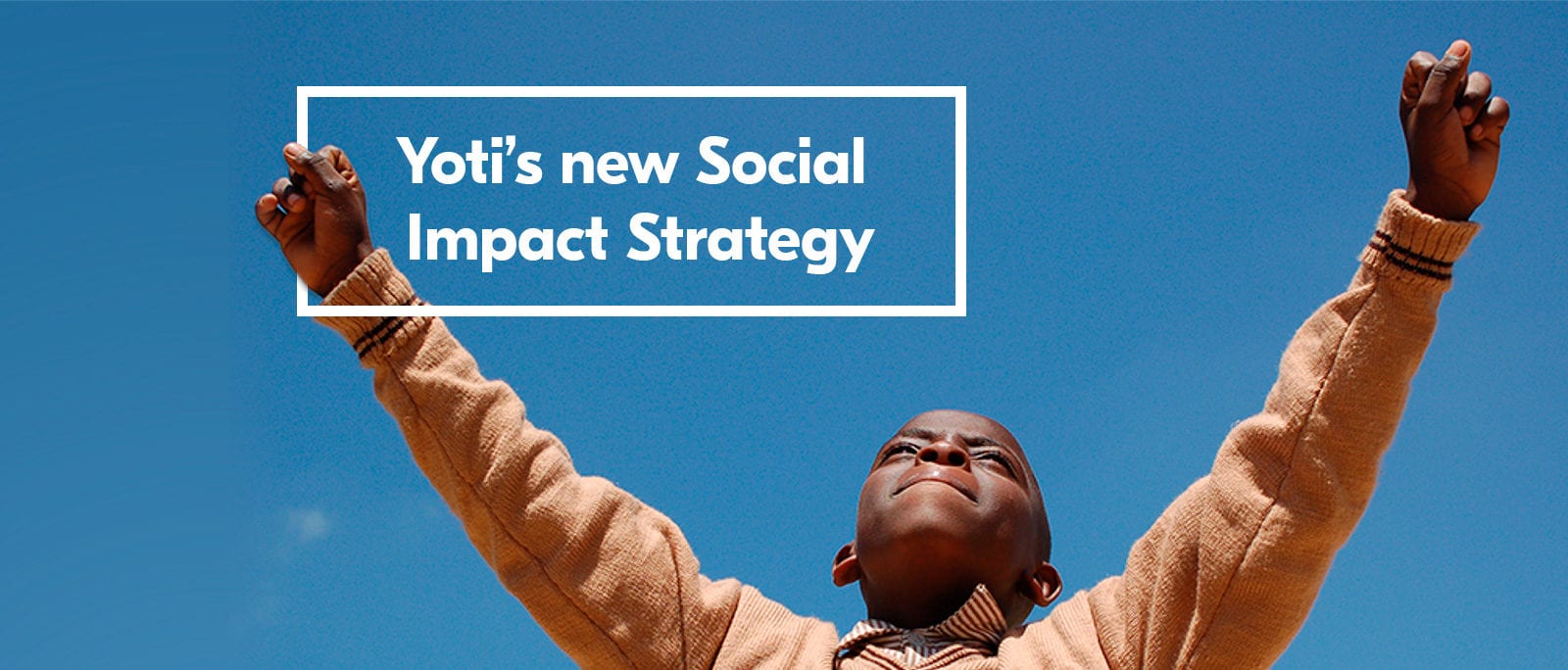 An image of a person with both arms in the air, as if in celebration. The text reads: Yoti's new Social Impact strategy