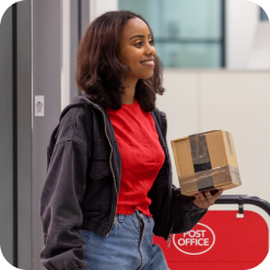 Girl holding a parcel in the Post Office
