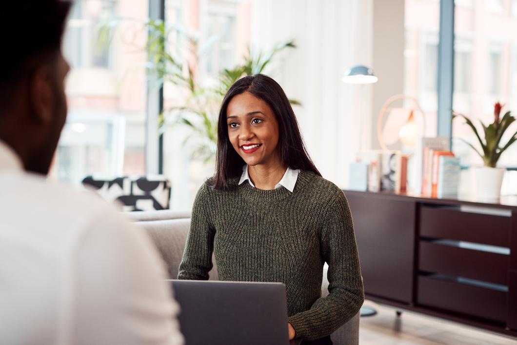 Woman with laptop doing digital right to work check