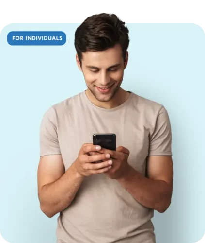 A man smiling whilst looking at his phone with additional text saying "for individuals"