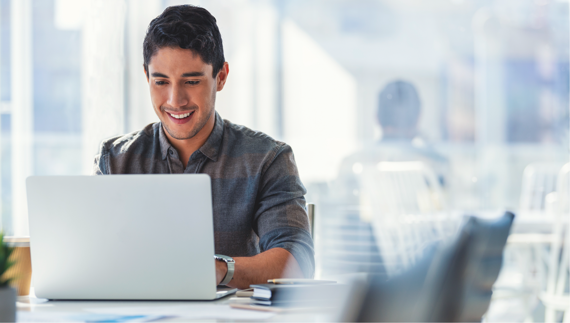 Man working at laptop in office setting