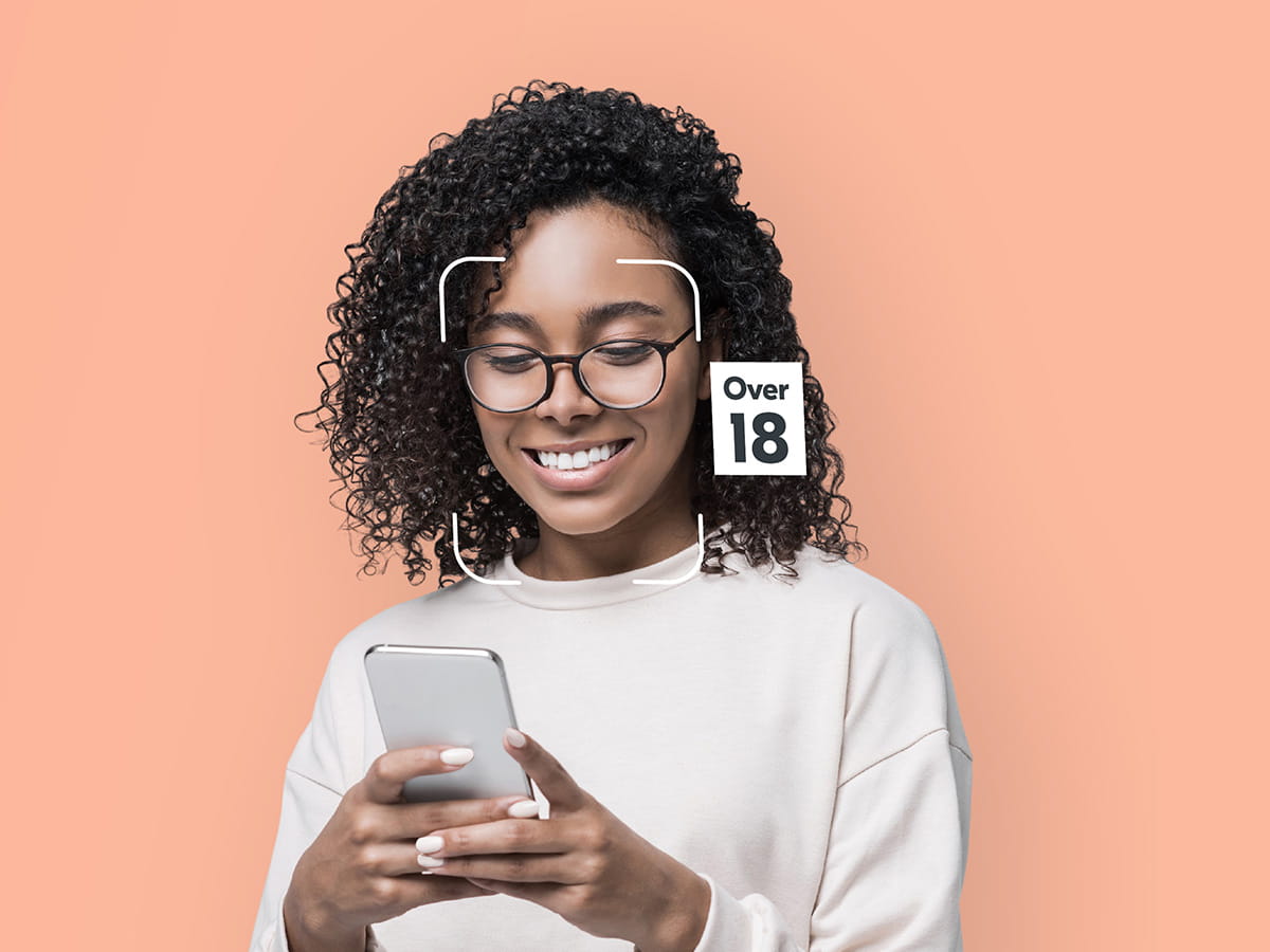 Woman looking at phone smiling