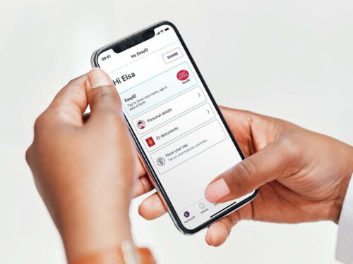 Person holding phone open on the easyID home screen